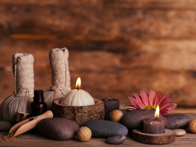 Table of candles and massage accessories